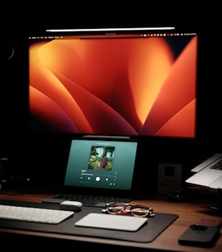 Studio desk with a render on screen.